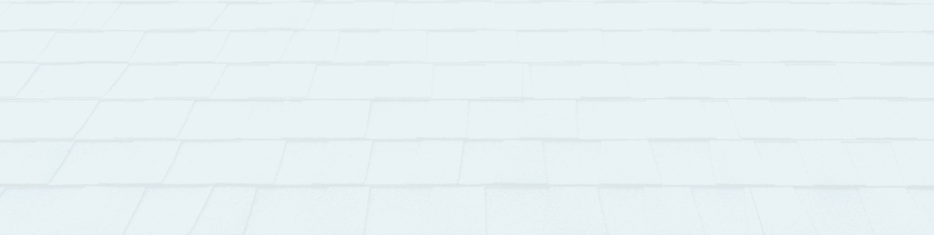 Surface de toiture en bardeaux, vue en gros plan, illustrant un toit propre et bien entretenu à St-Jérôme.